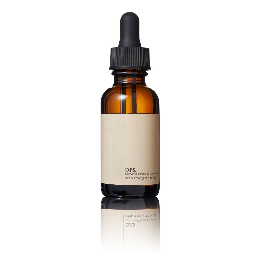Brown glass dropper bottle with a beige label on a white background
